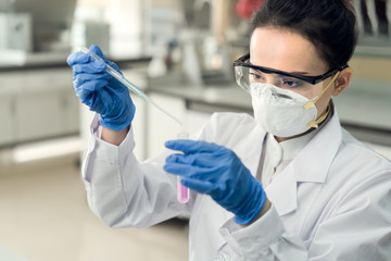 Female scientist working in the laboratory.