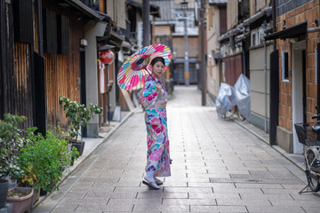 Women Floral Printed Long Kimono in Gion House is an old wooden, traditional style at Gion Shijo Kyoto Japan.
