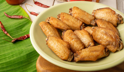 Crispy Baked Chicken Wings on white table.