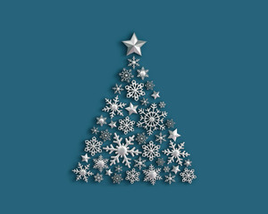 Silver snowflakes in the shape of a Christmas tree on blue