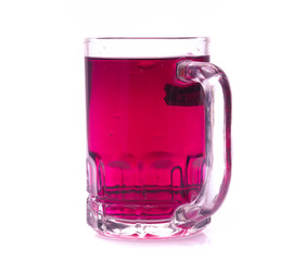 Glass of red grape juice with fruit isolated on white