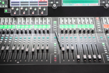 Sound mixer. Professional audio mixing console with lights, buttons, faders and sliders.