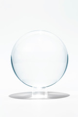 Transparent, grey color sphere made from glass.