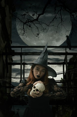 Halloween witch holding a skull standing over damaged old wooden bridge, bird, dead tree, full moon...