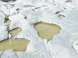 weathered rocks and sand background