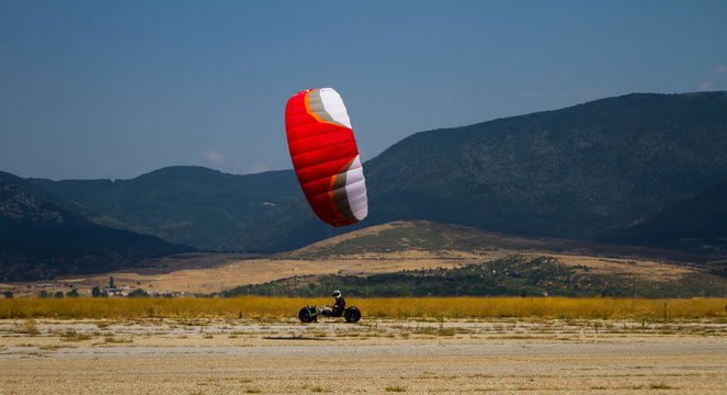 Fast speed kite buggy on the road.