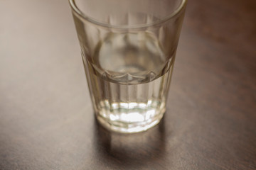 Faceted glass with water. Drink in a glass mug. Just water.