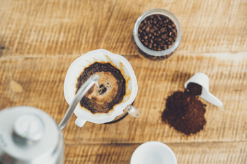 Drip coffee make a cup of coffee On the wood background