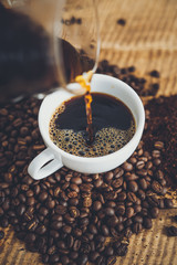 Drip coffee make a cup of coffee On the wood background