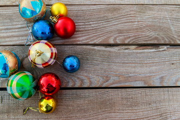 Christmas baubles on wooden background. Top view, copy space