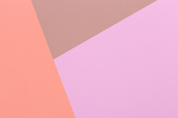 Paper orange, pink, brown empty background, geometrically located. Color blank for presentations, copy space.