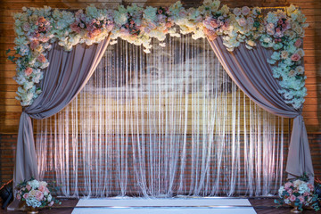 Wedding arch for wedding ceremony. Beautiful wedding decor in rustic style