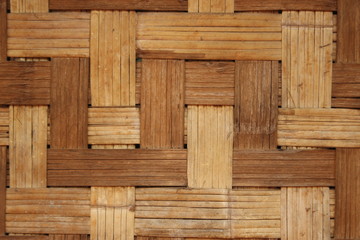 woven patterned bamboo matting wall in a traditional handmade rural hut in Northern Thailand, Southeast Asia