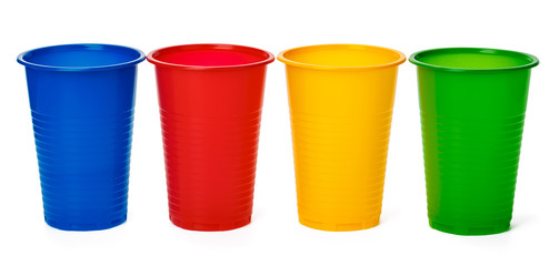 Colored plastic cups isolated on white background