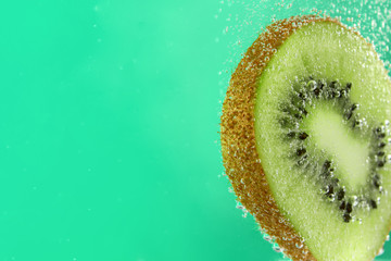 Ripe kiwi slice in water, closeup