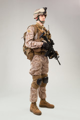 United states Marine Corps special operations command  raider with weapon. Studio shot