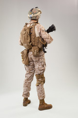 Rear view of military soldier US army marines operator studio shot portrait