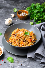 Spelt Pumpkin Mushroom Risotto on Grey Background, Vegetarian Meal