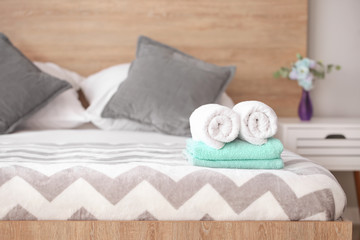Fototapeta na wymiar Soft clean towels on bed