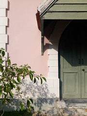 The vintage style concept of the background of the building wall with doors and trees is an element, the architecture of the building that blends perfectly with the composition of the picture