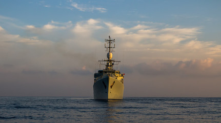 war ship sails and  patrol into the sea.