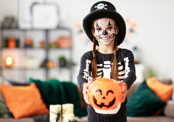 happy   child girl in skeleton costume to halloween.