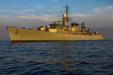 war ship sails and  patrol into the sea.