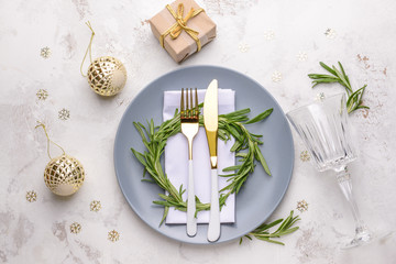Beautiful table setting for Christmas dinner on light background