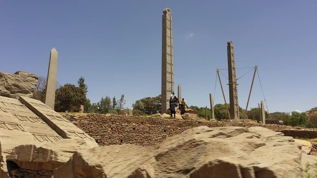 Flying past partly renovated obelisks (stelea), some of which were stolen by Italy and later repatriated, archaeology and tourism in Aksum, Ethiopia