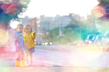 children cross the road / boy and girl small children in the city at the crossroads, car, transport