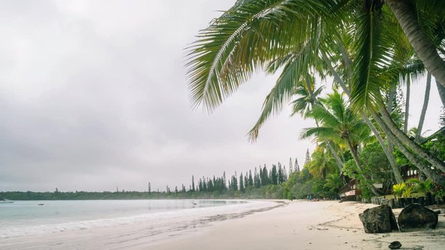 4k Timelapse Video -Foggy Morning but fairly warm weather for a swim at Kuto Bay Beach on the Isle of Pines in New Caledonia - French Polynesia, South Pacific.