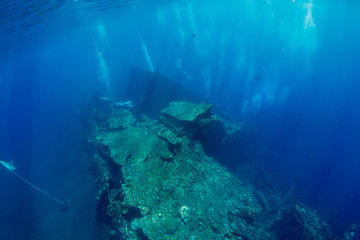 Shipwreck in underwater with air bubbles. Diving in ocean