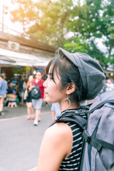 Young Asian cute woman traveler tourist shopping walking on the famous local street market with backpack , food local , vacation,hipster tourism concept