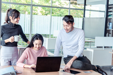 Teamwork business concept .Start up business people in modern office, working together having success. Multiethnic start-up business team on meeting in modern bright office interior brainstorming