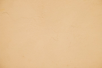 Empty orange painted textured wall