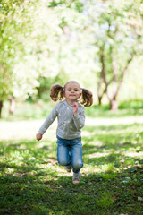 Portrait of a little girl jumping high up