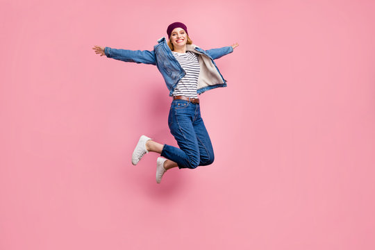 Full length body size photo of jumping excited cheerful amazed girl having learned that her boyfriend has started working as school director while isolated with pink background