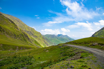 The most dangerous mountain road Georgia Tusheti, green meadows mountain landscape