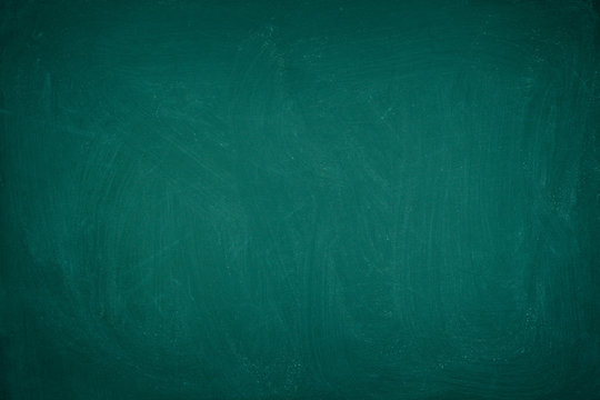 Working place on empty rubbed out on green board chalkboard texture background for classroom or wallpaper, add text message.