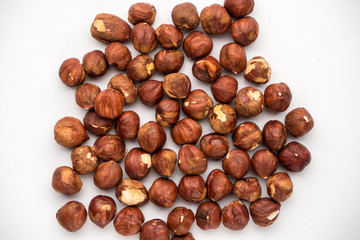 Obraz premium nutritious nuts, hazelnuts on a white background
