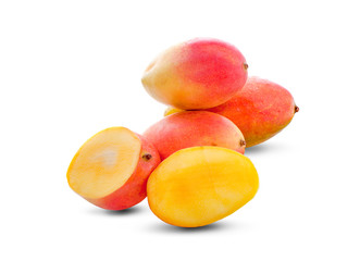 mango with slices and green leaves isolated on white background. healthy food.