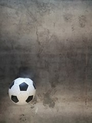 Soccer ball on steel plate.