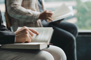 people reading the holy bible. Two man reading a book. teacher and student reading together.