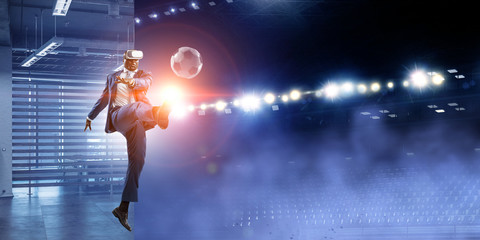 Fototapeta na wymiar Black Man and Virtual Reality Soccer Match