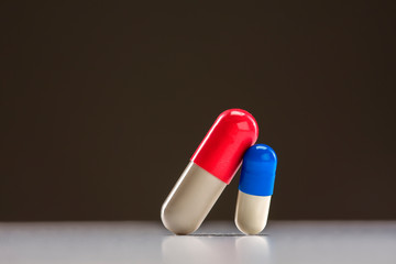 Medical capsules isolated on dark background.Closeup.