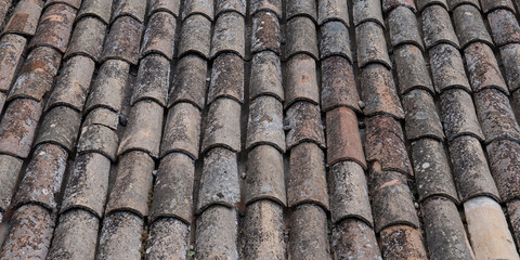 Colorful provence ancient french roof tiles background in web banner template header panorama