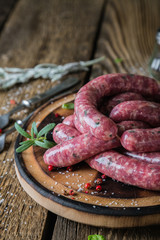 Raw homemade sausages with spices