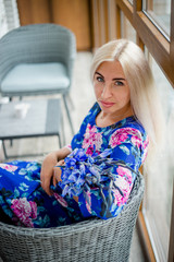 Girl in a blue dress with flowers