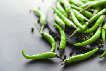 Hot green pepper. Chilean pepper on a black.