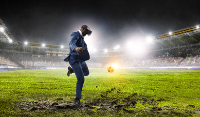 Black businessman on virtual reality football match